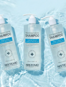 Three bottles of Histemo Fresh Scalp Cooling Shampoo arranged on rippling blue water, with white pump dispensers and clear labels.