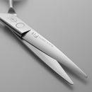 Hair cutting scissors with FIT Mizutani scissors Canada brand blades close up